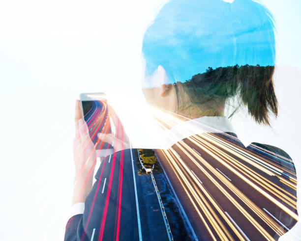 istock Multiple exposure of businesswoman using mobile phone 957990740