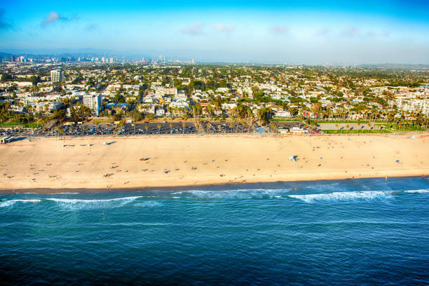 The beach along the coast of Santa Monica, California with the skyline of Los Angeles in the background.