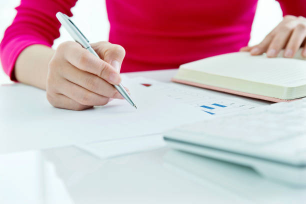 istock Woman hand writing in a paper 957995046