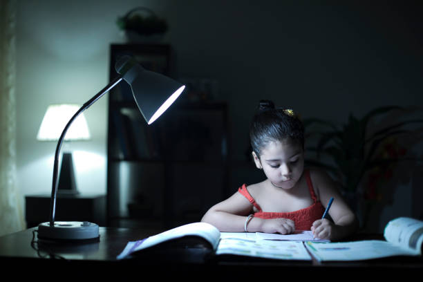 istock Girl doing homework at home 957999250