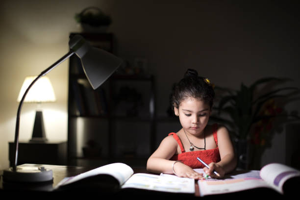 istock Girl doing homework at home 957999298