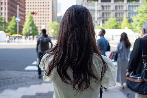 young woman walking in Tokyo, Marunouchi