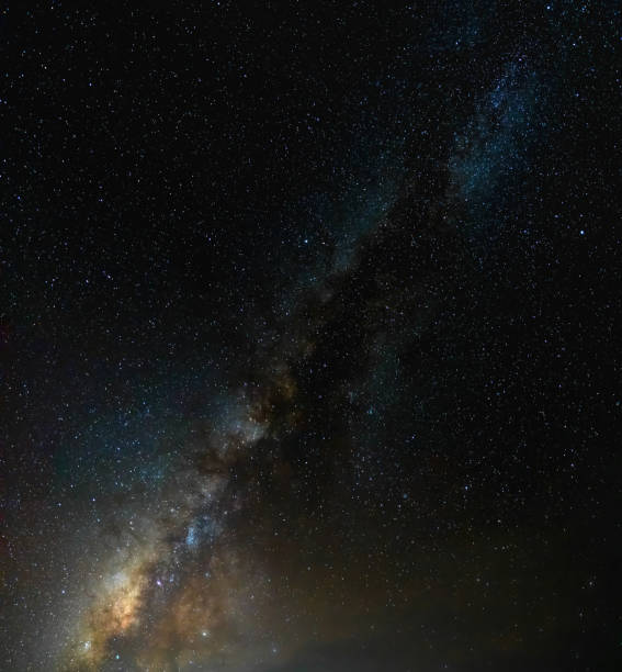 istock beautiful vertical milky way on sky. 958004148