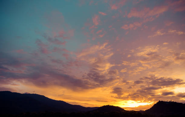 istock silhouette shot image of mountain and sunset. 958004376
