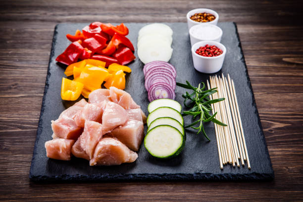 istock Raw chicken fillet on stone background 958004638