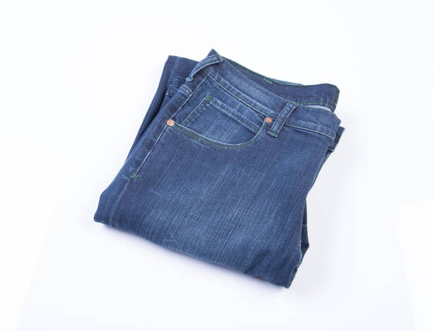 istock jeans or blue jeans on a background 958004892