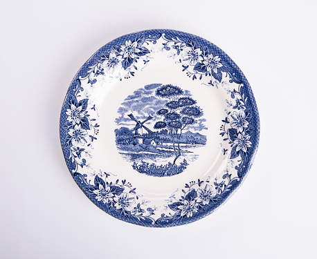 plate or flowers on plate painted by hand on background