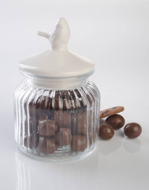 istock jar or glass jar with chocolate ball on the background 958008986
