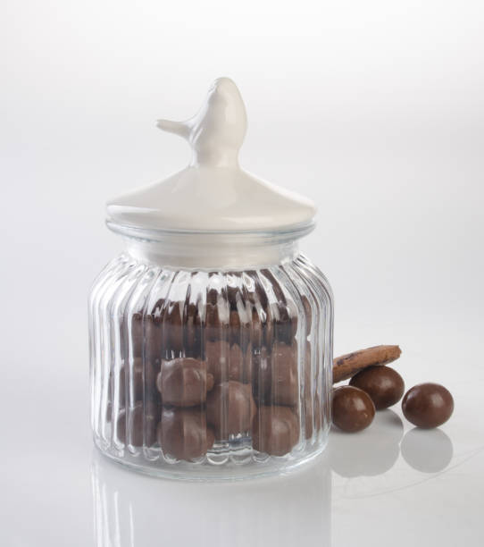 istock jar or glass jar with chocolate ball on the background 958008996