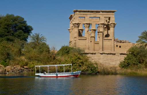 Woman walking in Temple of Philae aka Temple of Isis in Aswan Egypt