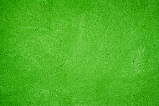A green colored old wall texture background.