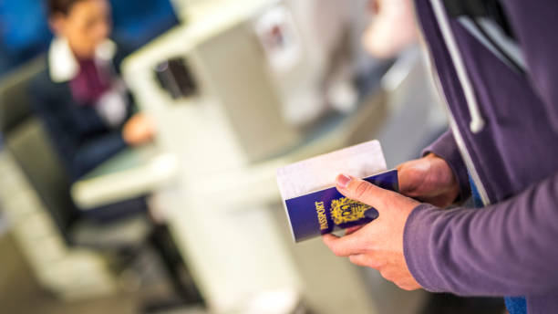 istock Traveler holding passport 958016574