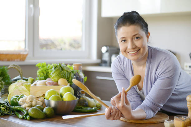 istock woman cooking in the kitchen 958016582