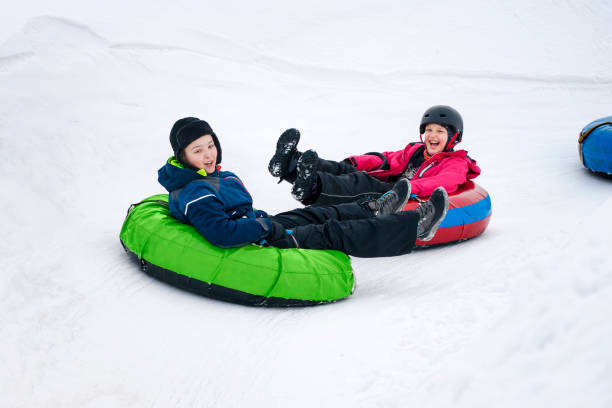 istock Kids Winter Snowtubing 958017198