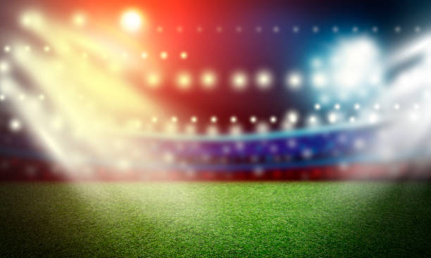 istock Soccer field and spotlight background in the stadium 958017320