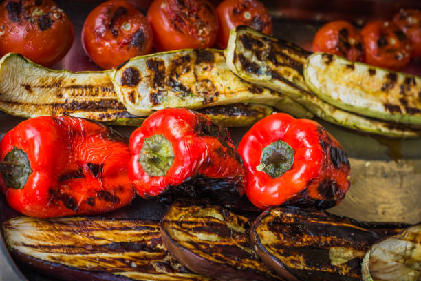istock peppers, aubergines, tomatoes and zucchini roasted and slightly burnt 958020176