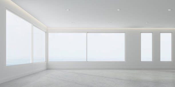 istock 3D rendering of white room space with interior lighting and sun light cast the window shadow on the wall and floor,Perspective of minimal design architecture 958021382