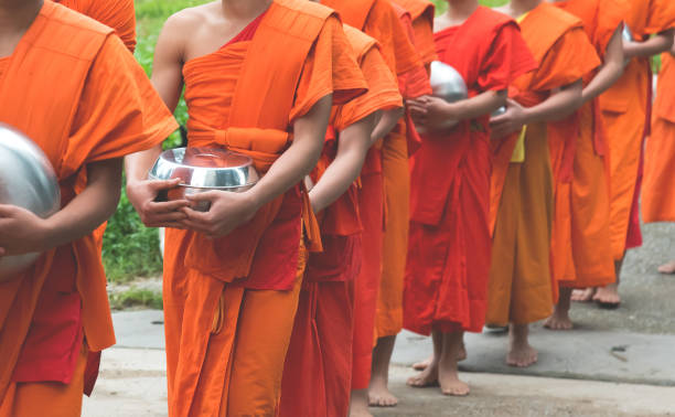 istock unrecognizable monk walking on street. 958021862