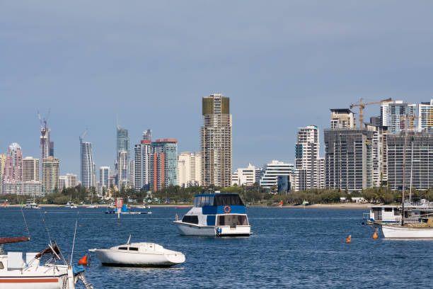 istock Boats moored in front of high rise 958025236