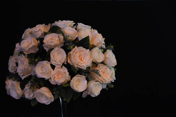 istock A bouquet of flowers on a black background 958026158