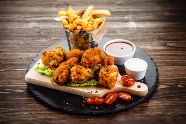istock Chicken nuggets and French fries 958026448
