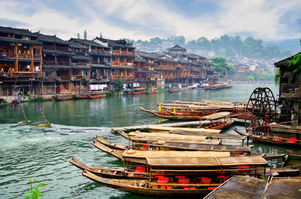 Old houses in Fenghuang county in Hunan, China. HUNAN, CHINA - JUNE 16, 2014 : Old houses in Fenghuang county in Hunan, China. The ancient town of Fenghuang was added to the UNESCO World Heritage Tentative List in the Cultural category. hunan province photos stock pictures, royalty-free photos & images