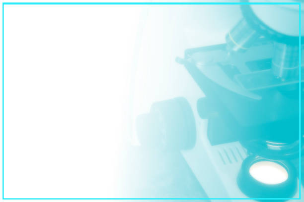 Laboratory Microscope over white blue gradient background. Scientific or medical research background. Blurred background for medical concept with copy space for text, blue frame