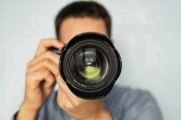istock The man use the professional camera with telephoto lens 958031108
