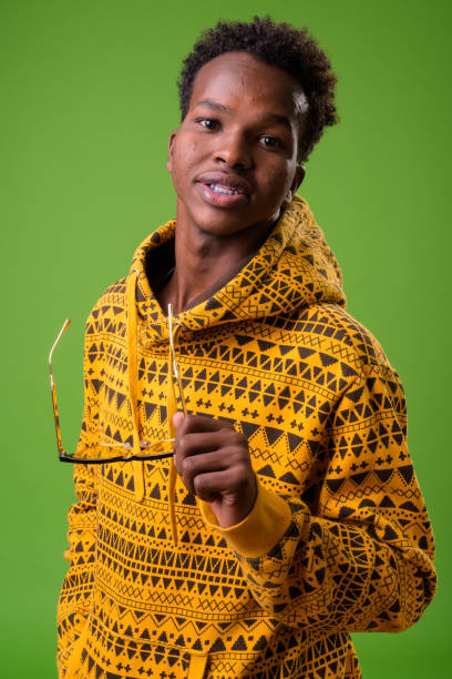 istock Young African man against green background 958033968