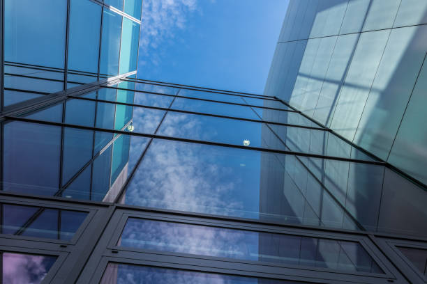 istock The glass architecture in city against a sky 958037650