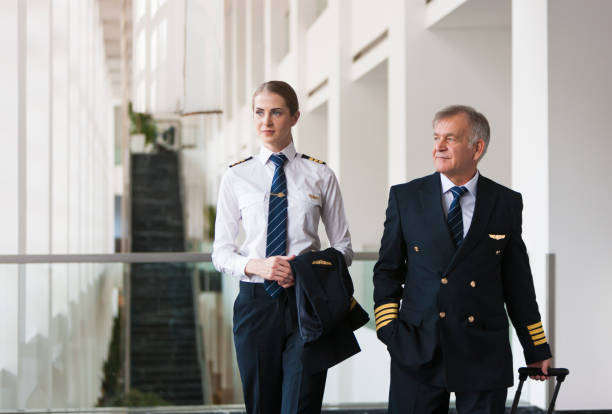 istock Flight crew walking in the airport terminal 958039098