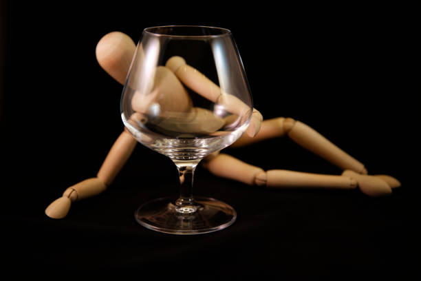 istock Artist mannequin behind empty snifter 958039626