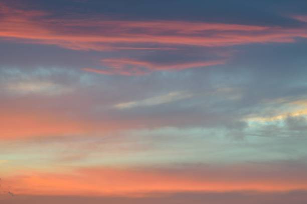 istock Nature background of vibrant colorful sunset clouds 958043280