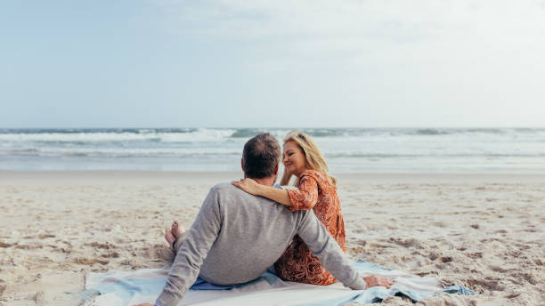 istock Mature couple spending time on the beach 958044154