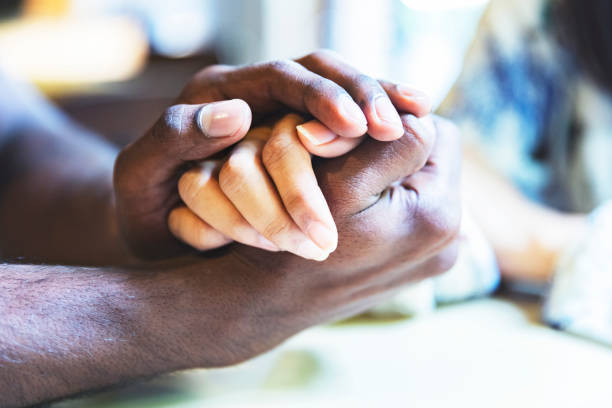 istock Interracial couple holding each other’s hand 958046688