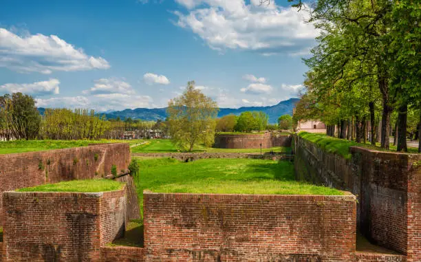 View of Lucca ancient city walls, ramparts and moat, completed in the 17th century and now a public park