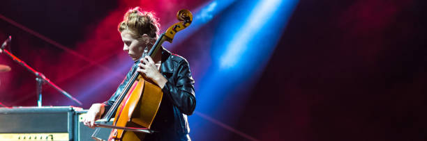 istock Woman playing cello on the stage 958049380