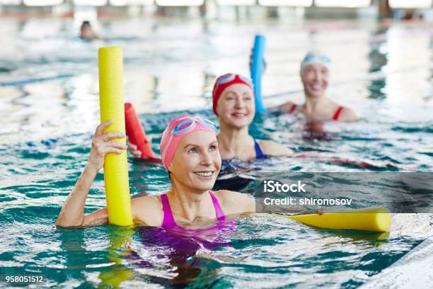 Aerobics In Swimming Pool Stock Photo - Download Image Now - Exercising, Swimming Pool, Senior Adult