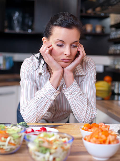 istock Depressed and sad woman in kitchen 95805780
