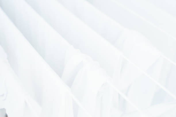 istock White clothes and bed linens in the dryer. 958060766