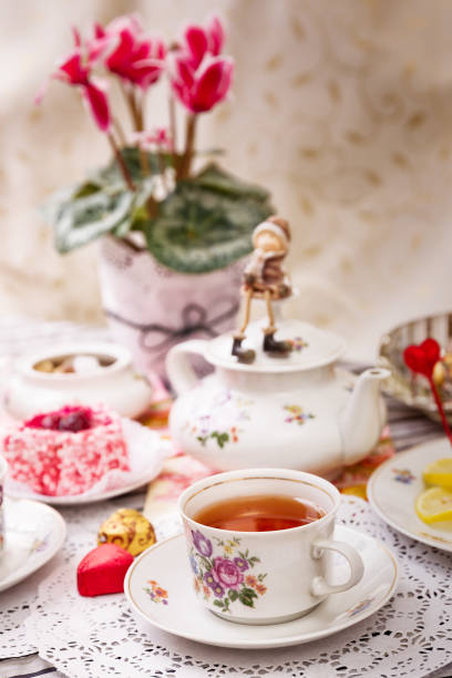 istock Porcelain cup of tea with lemon and sweets 958061656