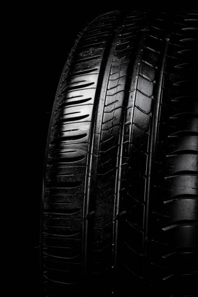 istock Car tyre isolated on a black background 958066338