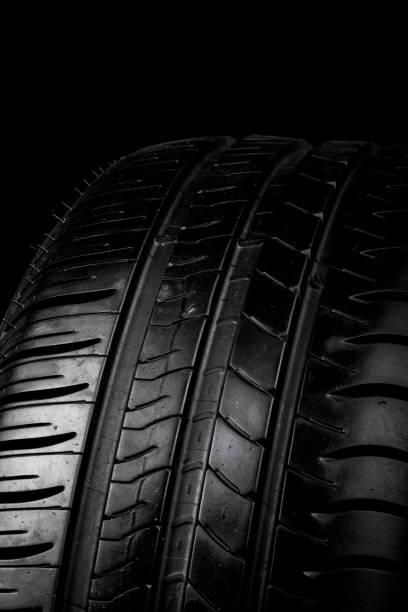 istock Car tyre isolated on a black background 958066456
