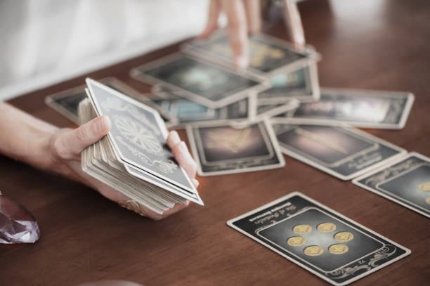 istock Woman is reading Tarot cards in cafe 958067072