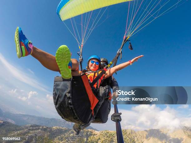 Paragliding Stock Photo - Download Image Now - Paragliding, Flying, Women