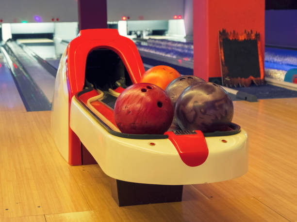 istock Colorful bowling balls on the bowling track. Game and Fun 958070392