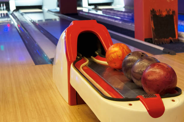istock Colorful bowling balls on the bowling track. Game and Fun 958070562