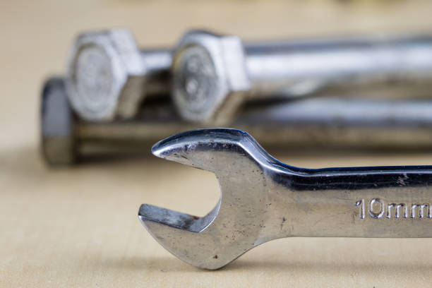 a bunch of metal keys on a white background