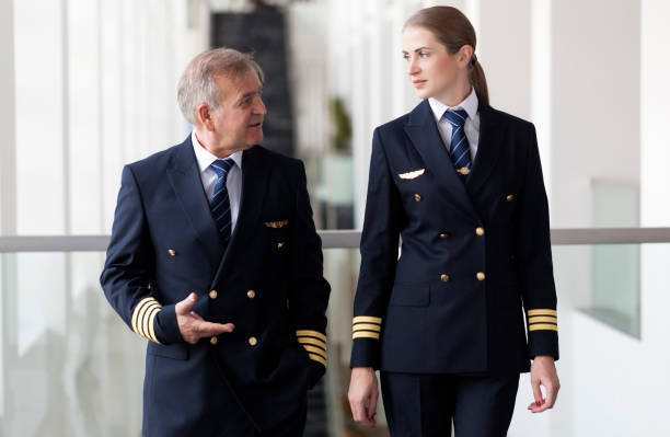 istock Flight crew walking in the airport terminal 958082270