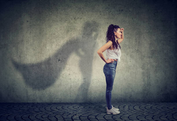istock Brave woman posing as super hero 958082312